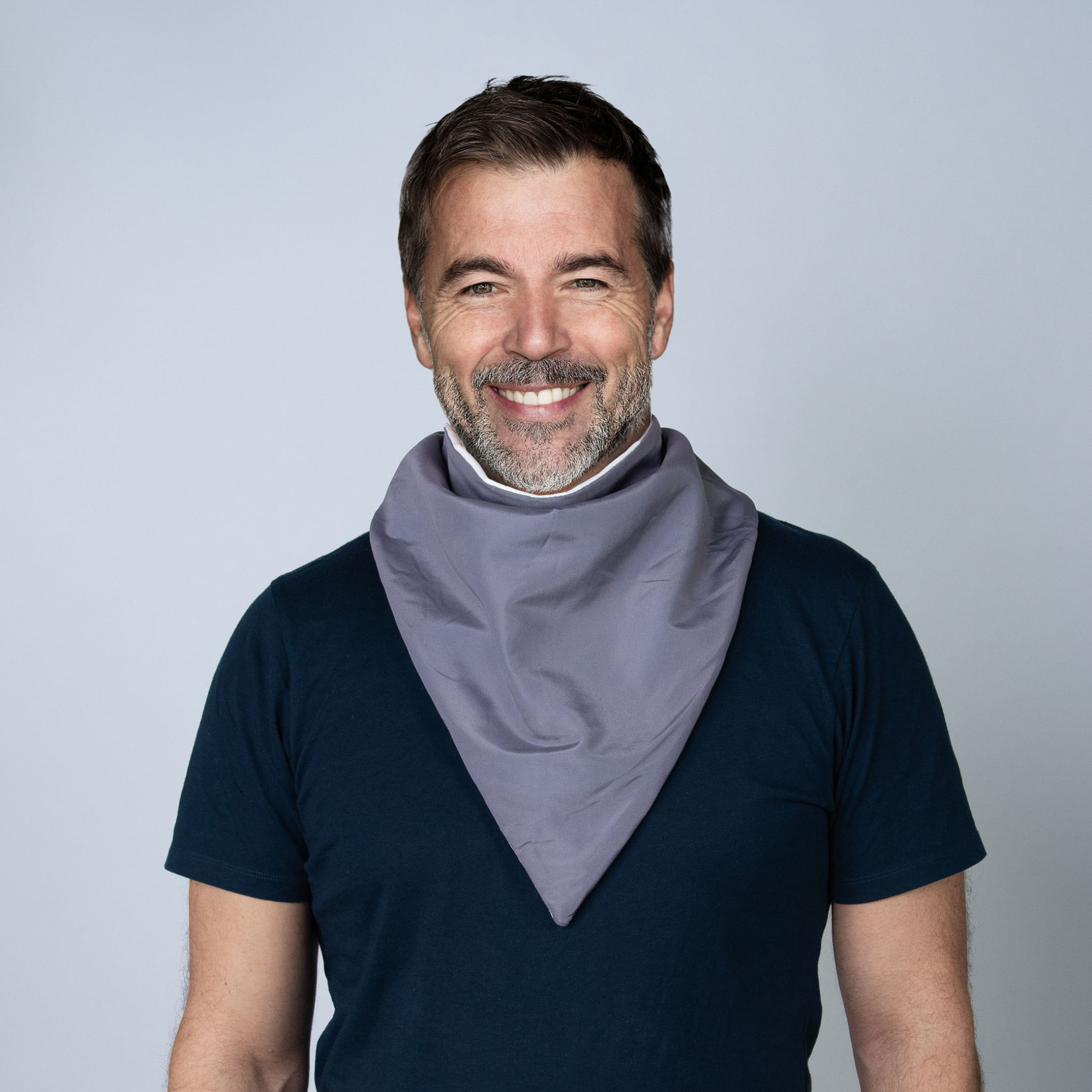 A man wearing a grey bandana