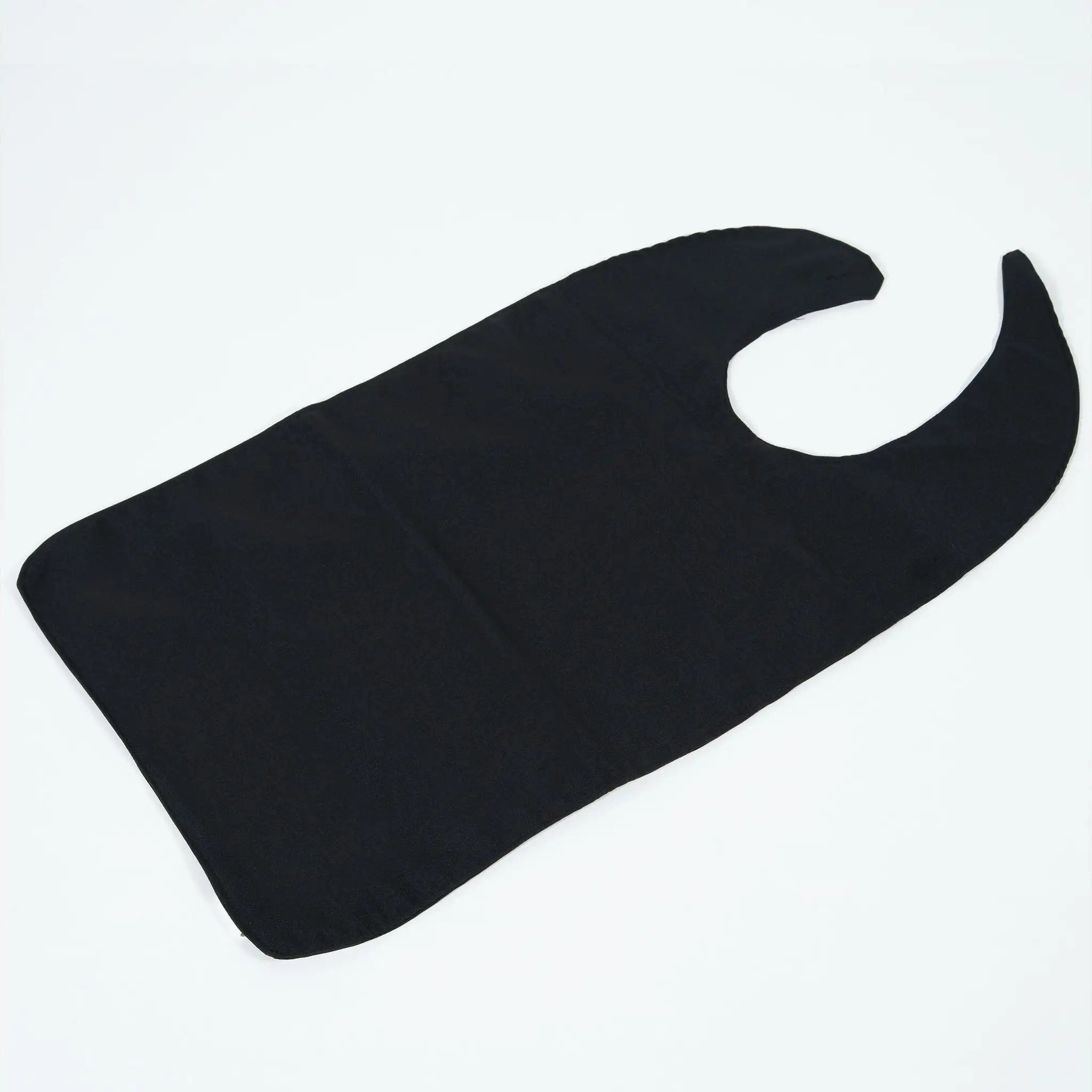 StayDry absorbent and waterproof clothing protector bib in black, displayed flat. Designed for adults and seniors, this full-coverage bib offers protection against spills, stains, and moisture with an easy-to-use hook-and-loop closure.