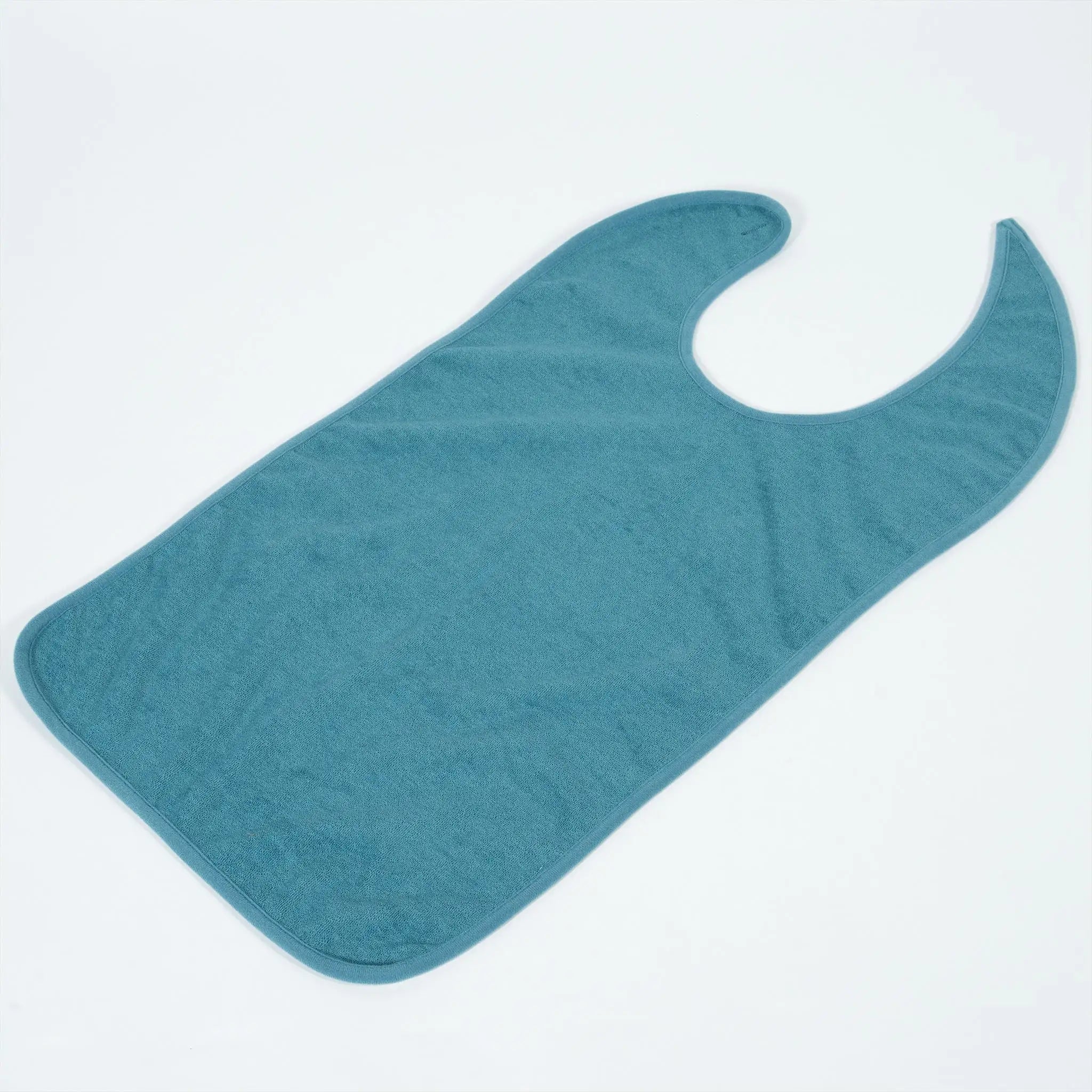 StayDry absorbent and waterproof clothing protector in teal, laid flat to showcase its full-coverage design. This adult bib is designed for seniors, individuals with disabilities, or messy eaters, featuring a soft, absorbent front and a waterproof backing for maximum protection against spills and stains.