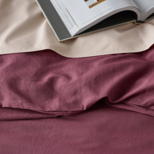 Close-up of a linen-look water-resistant quilt cover set in cacao colour, highlighting its soft texture and smooth finish.