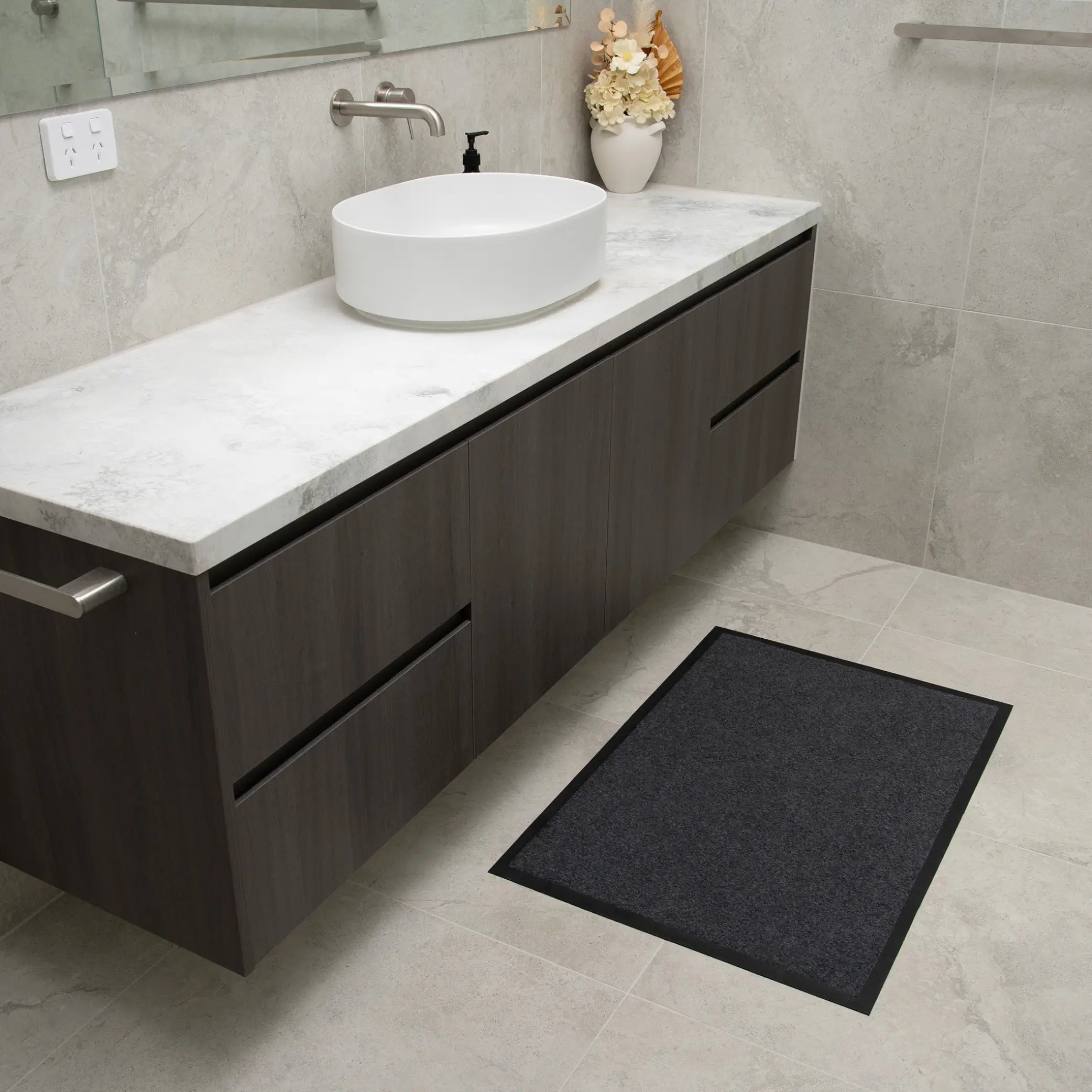 Charcoal grey non-slip waterproof floor mat designed for bathrooms and high-traffic areas. Featuring an absorbent, quick-dry surface with a slip-resistant backing, this durable mat provides superior moisture control and floor protection. Ideal for elderly care, incontinence support, or stylish home décor.