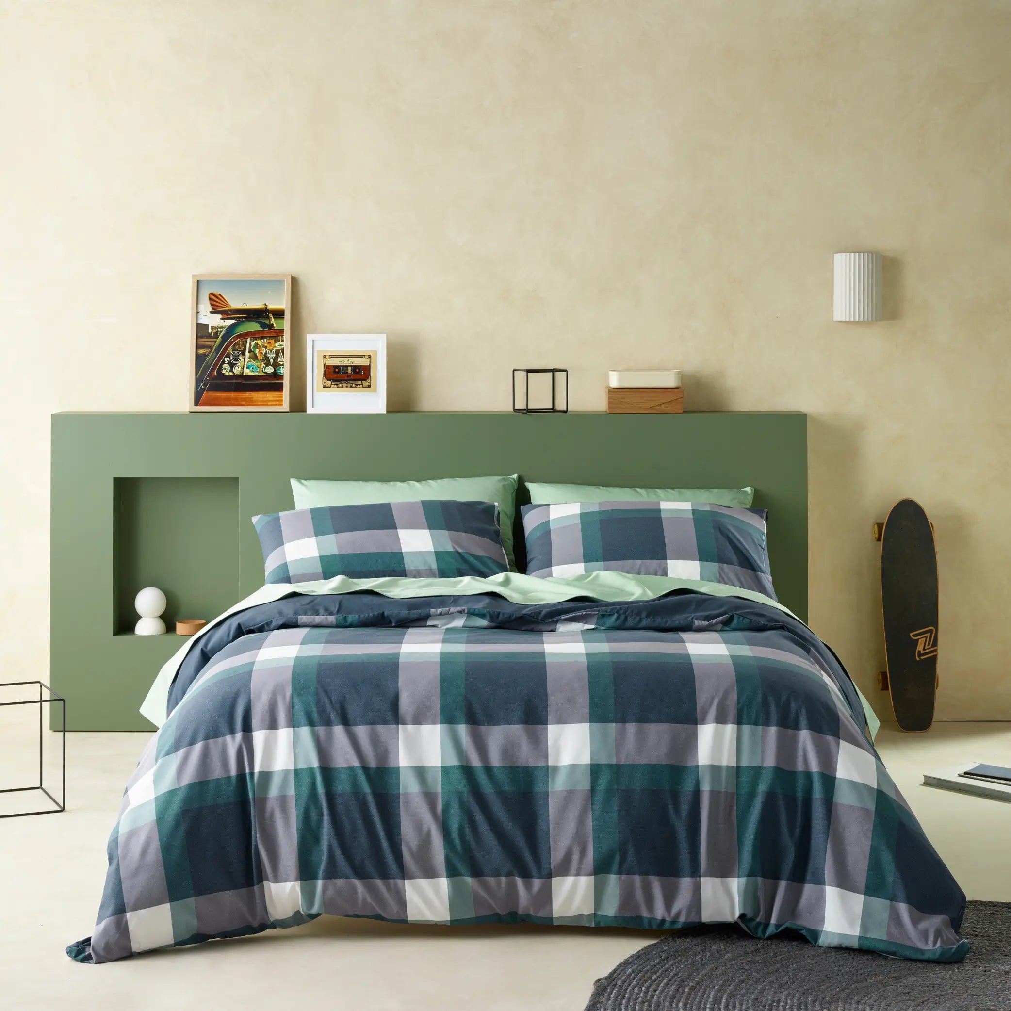 Modern bedroom styled with a water-resistant quilt cover set featuring a forest green and navy blue checkered pattern.