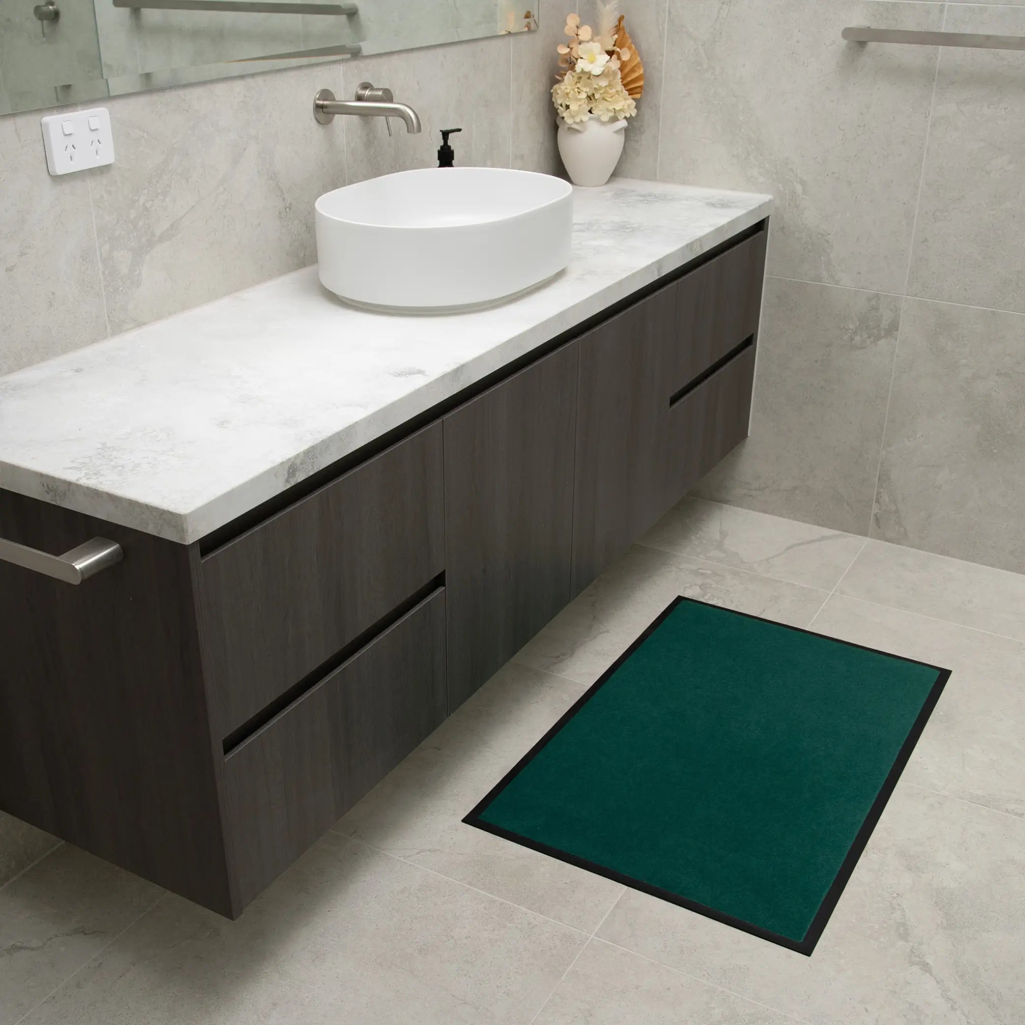 Green non-slip waterproof floor mat for bathrooms and high-traffic areas. Designed with an absorbent, quick-dry surface and slip-resistant backing, this durable mat protects floors from moisture, spills, and everyday wear. Ideal for elderly care, incontinence support.