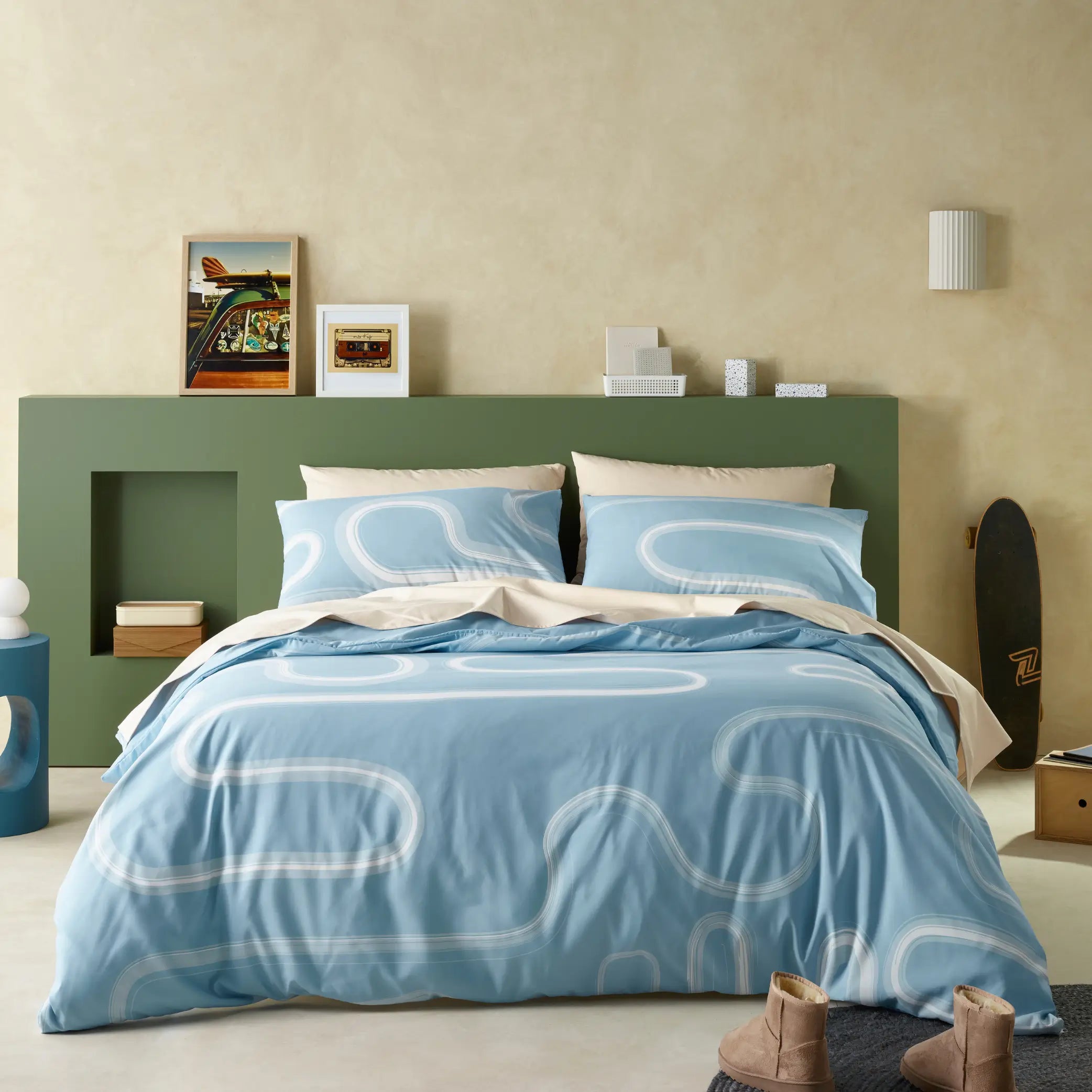 Modern water-resistant quilt cover set in a soothing blue shade, featuring an abstract white swirl pattern.