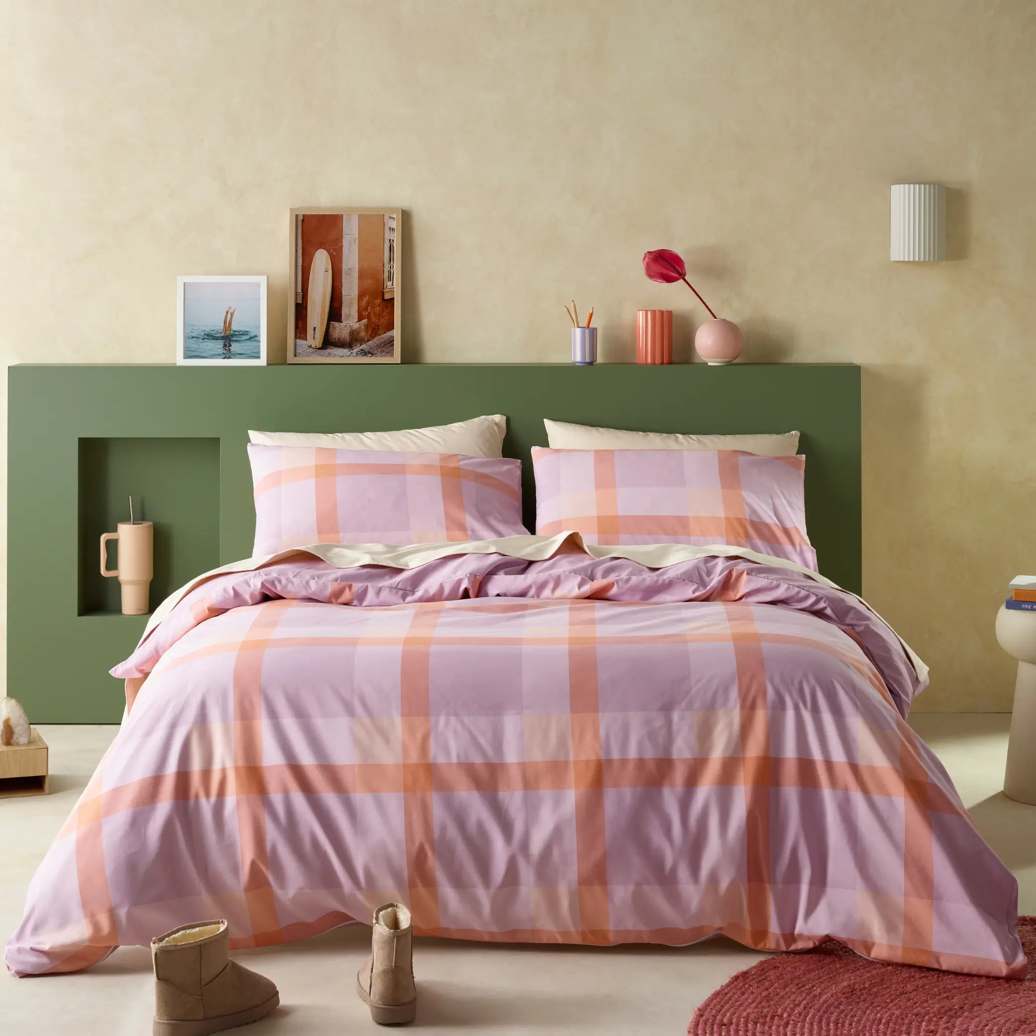 Bedroom styled with a water-resistant quilt cover set in a lilac and peach checkered pattern.