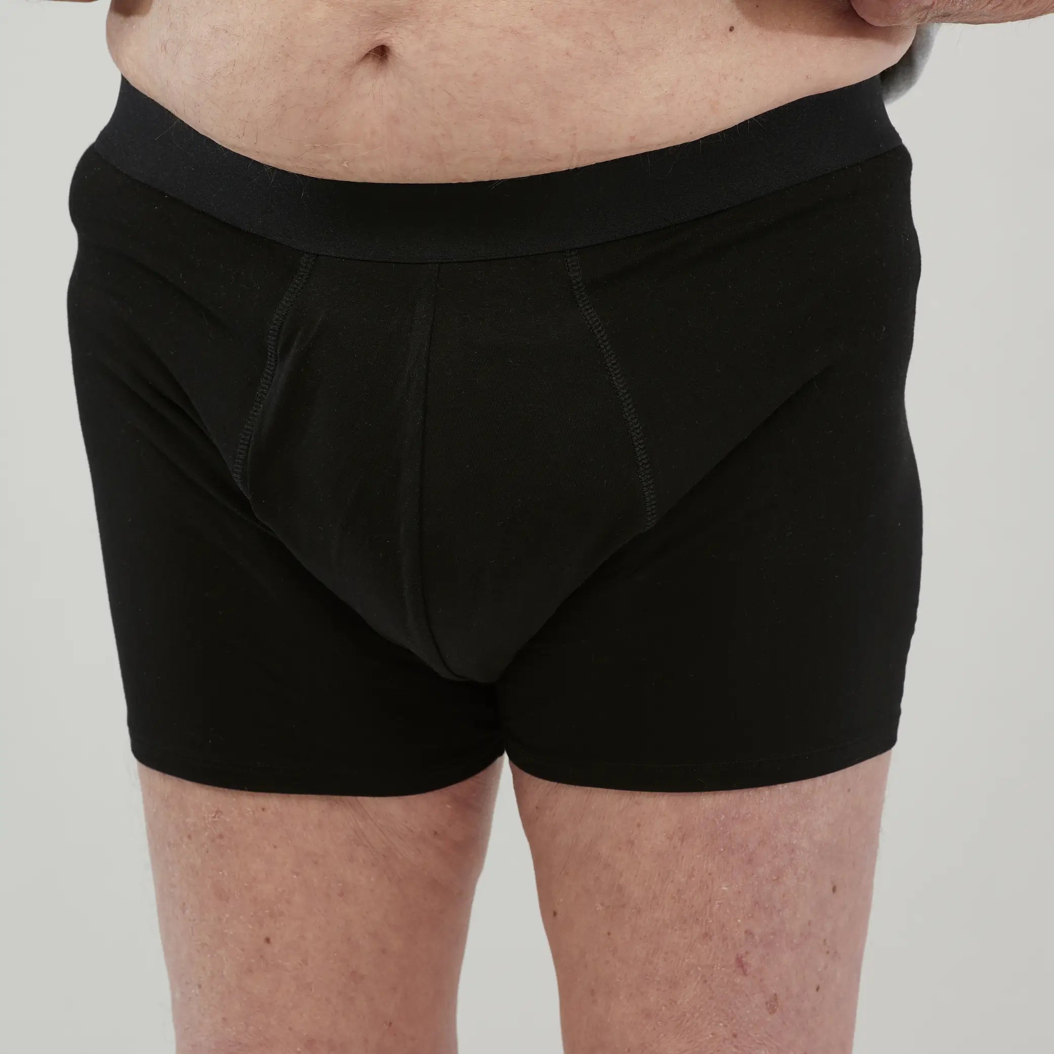 Front view of StayDry men's waterproof incontinence boxer briefs in black. Featuring a discreet, absorbent design for leak-proof protection.