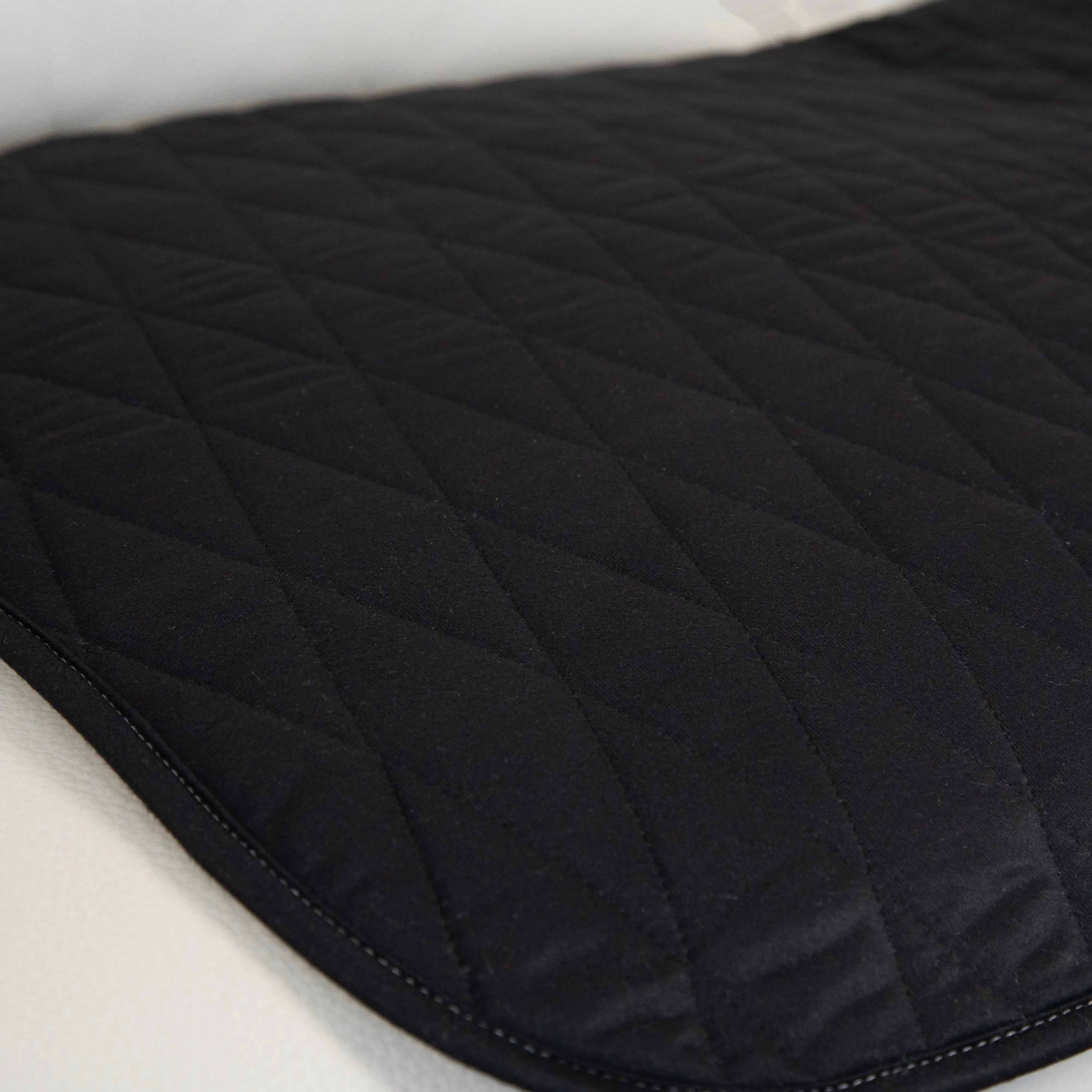 Close-up of the black waterproof couch pad with a quilted, ultra-absorbent surface. Ideal for incontinence protection, spills, and pet messes. Soft, durable, and stylish furniture protector.