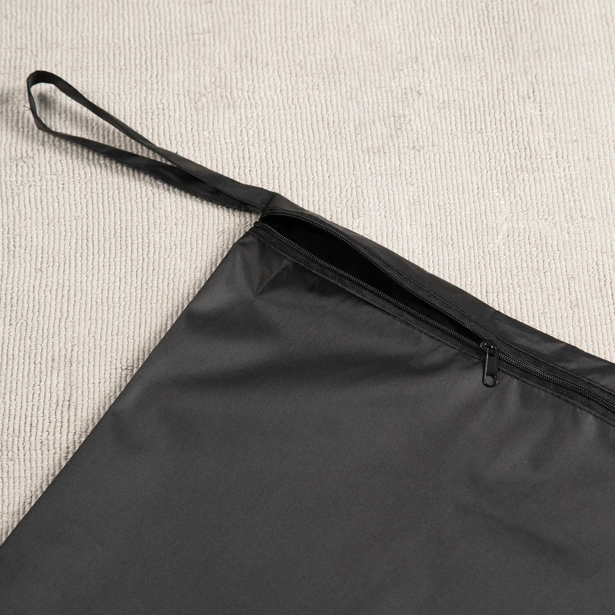 Black Staydry wet bag with a zip closure and wrist strap. Made from waterproof, leak-proof fabric, this reusable bag is ideal for travel, gym, baby nappies, swimsuits, and incontinence products