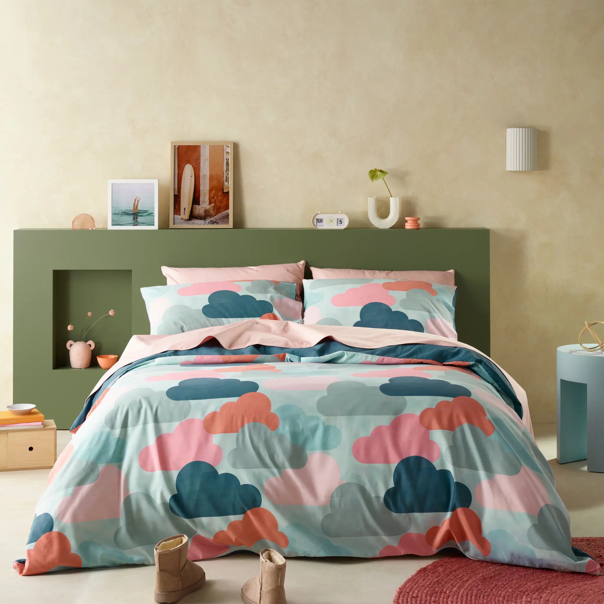 Vibrant water-resistant quilt cover set featuring a playful cloud pattern in pastel pink, teal, and peach hues. The modern bedding design adds a cosy and whimsical touch to any bedroom decor, with soft, durable fabric for lasting comfort.