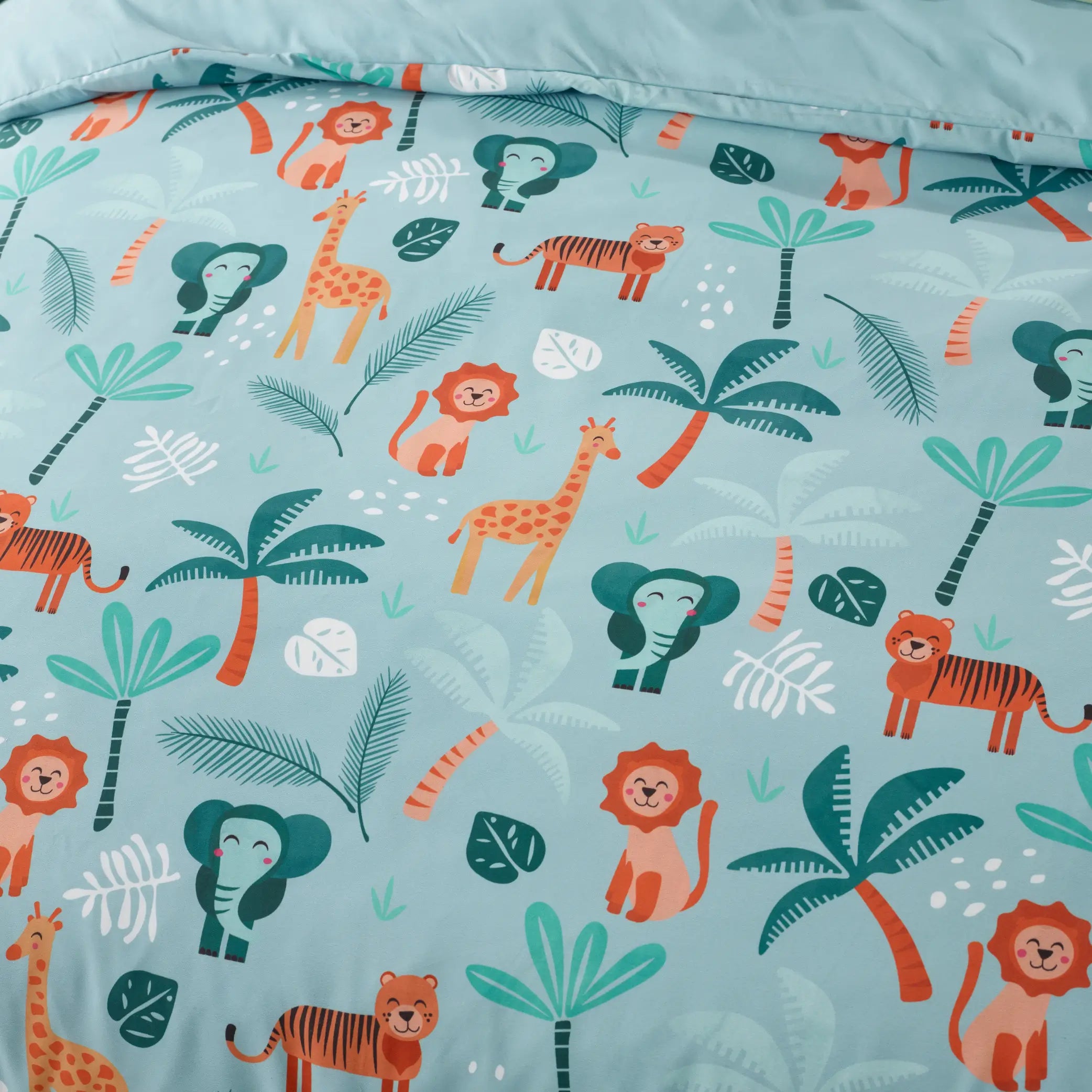 Close-up of a kids' waterproof quilt cover featuring a vibrant jungle explorer theme with smiling lions, tigers, giraffes, elephants, and tropical palm trees on a soft blue background. Crafted from moisture-resistant, breathable fabric, this durable and machine-washable bedding provides incontinence protection while adding a fun, adventurous touch to children's bedrooms. Perfect for easy-care and mess-free sleeping.